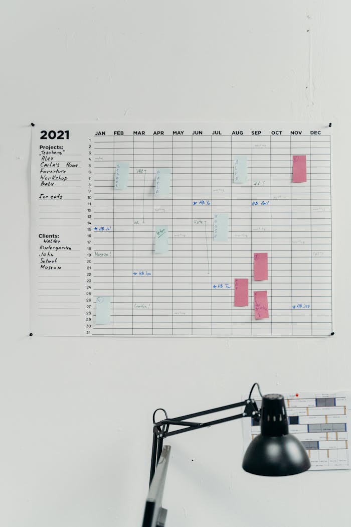 A 2021 wall calendar in a simple office setting for planning and scheduling.
